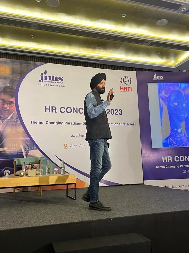 Harjeet walking the stage at an HR conclave in Delhi