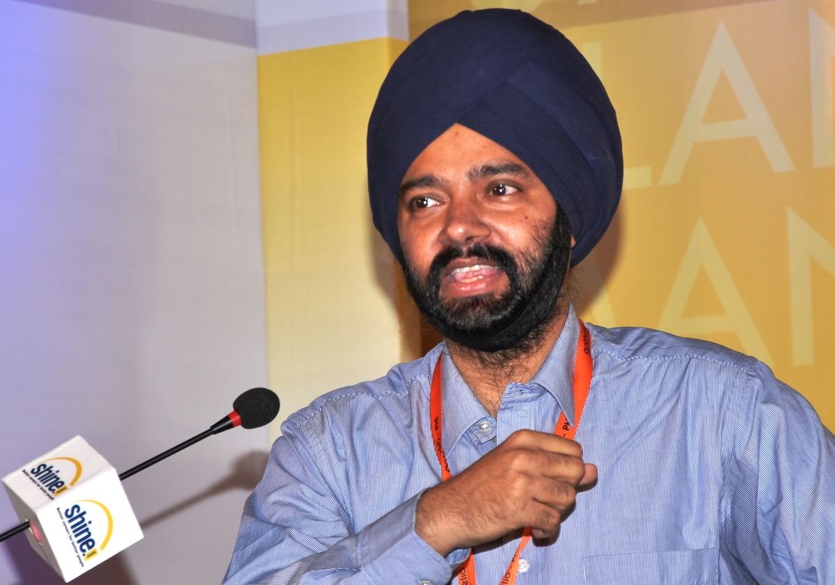 Harjeet speaking at a conference