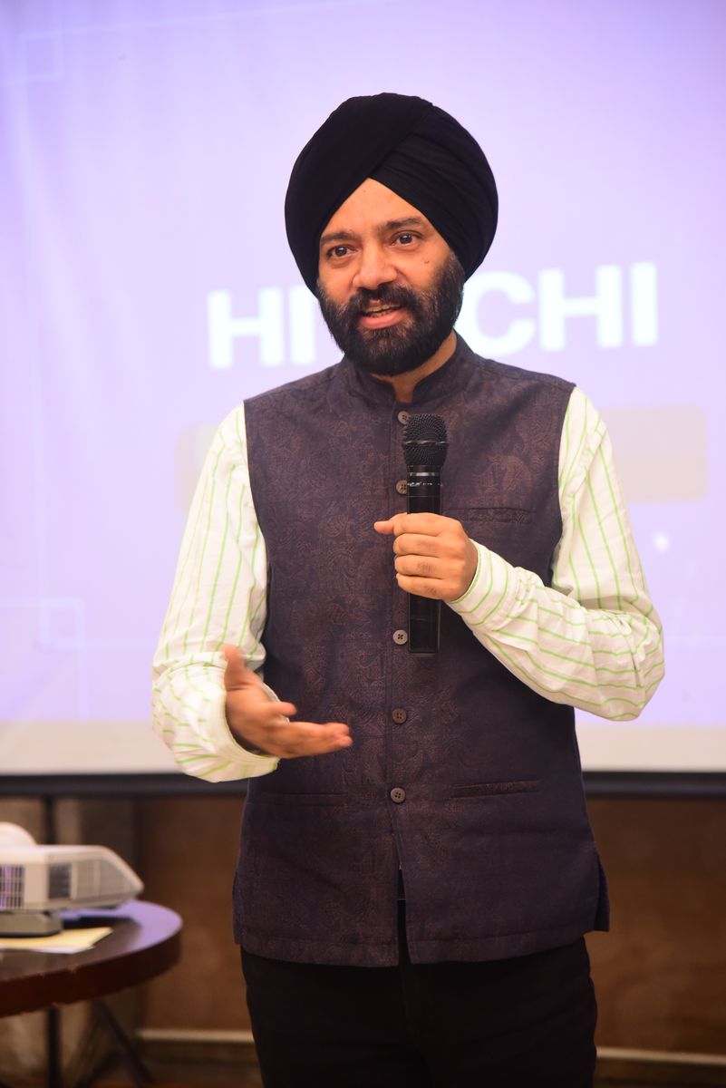 Harjeet leading a workshop with a microphone
