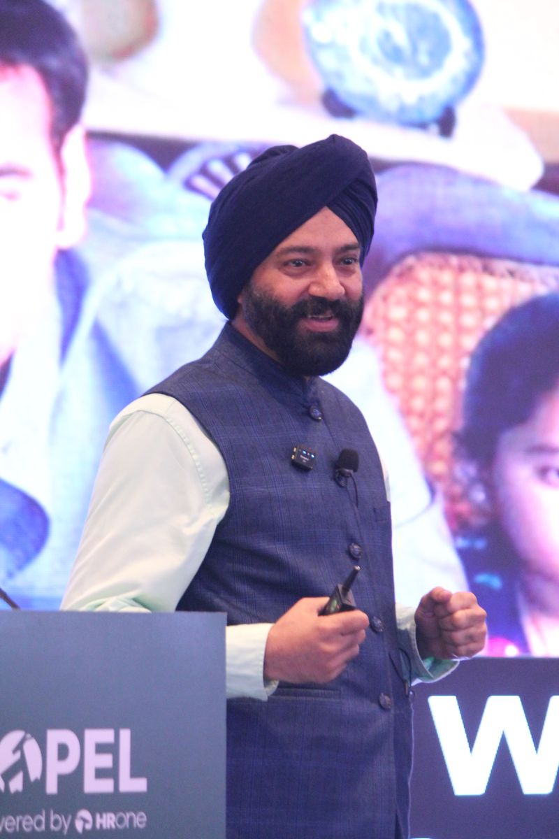 Harjeet smiling on stage