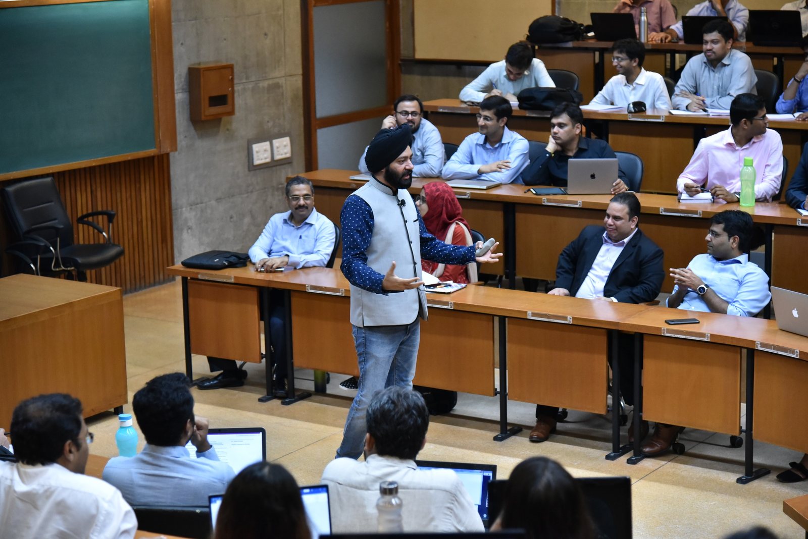 Harjeet teaching a classroom of management students