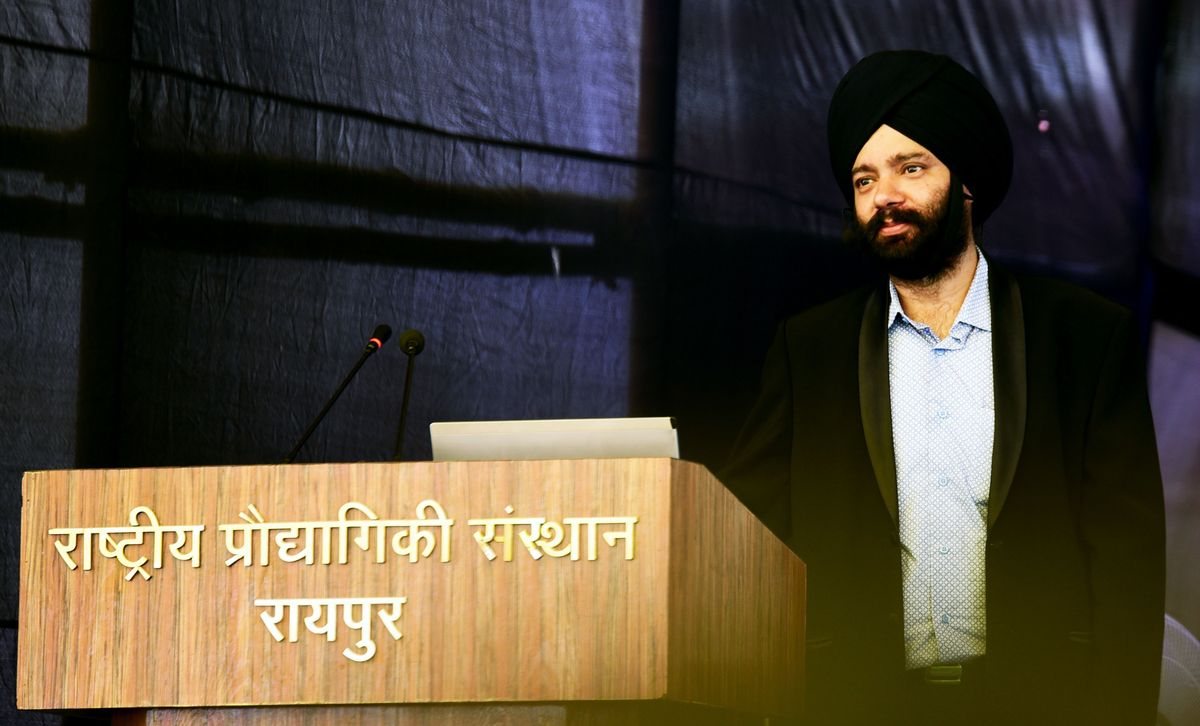 Harjeet at the lectern in Raipur